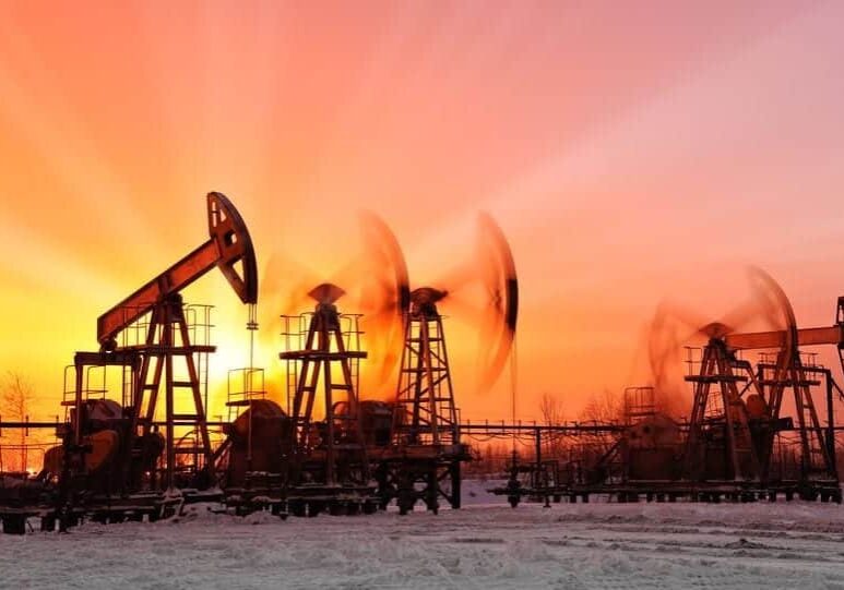 18410758 - oil pumps at sunset sky background